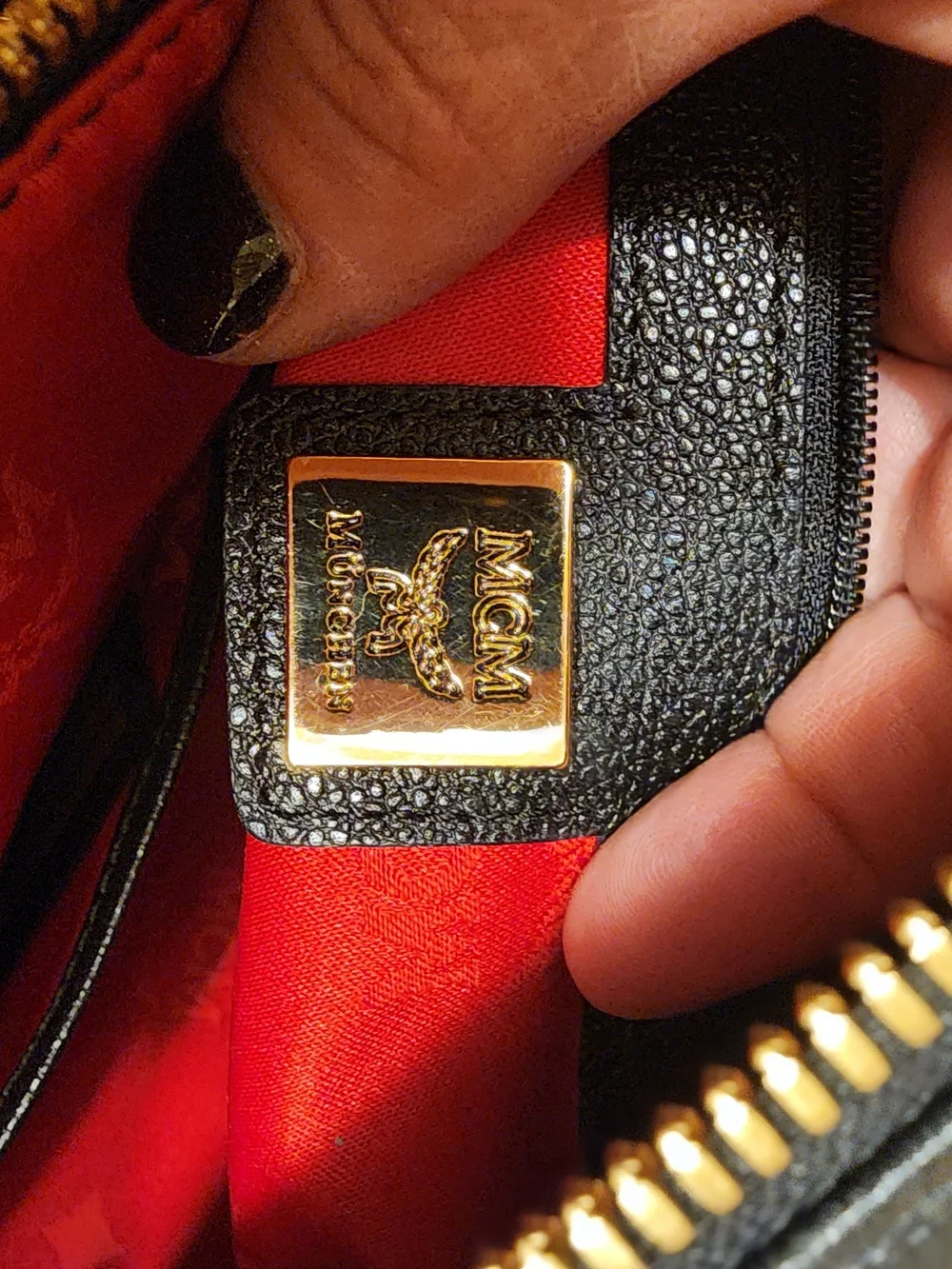 MCM Black Leather Boston Bag featuring polished gold-tone hardware